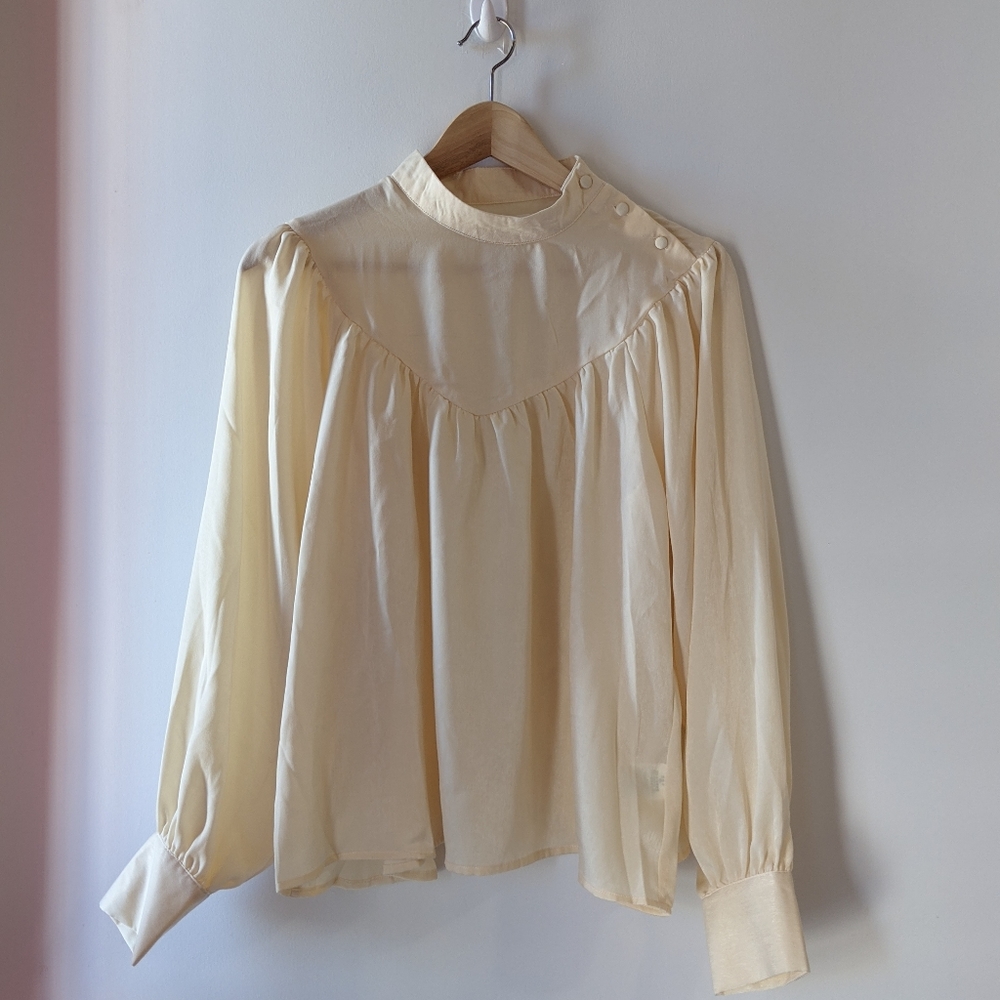 Cream blouse with puffy sleeves